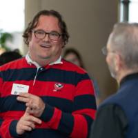 Two guests talk in the lobby